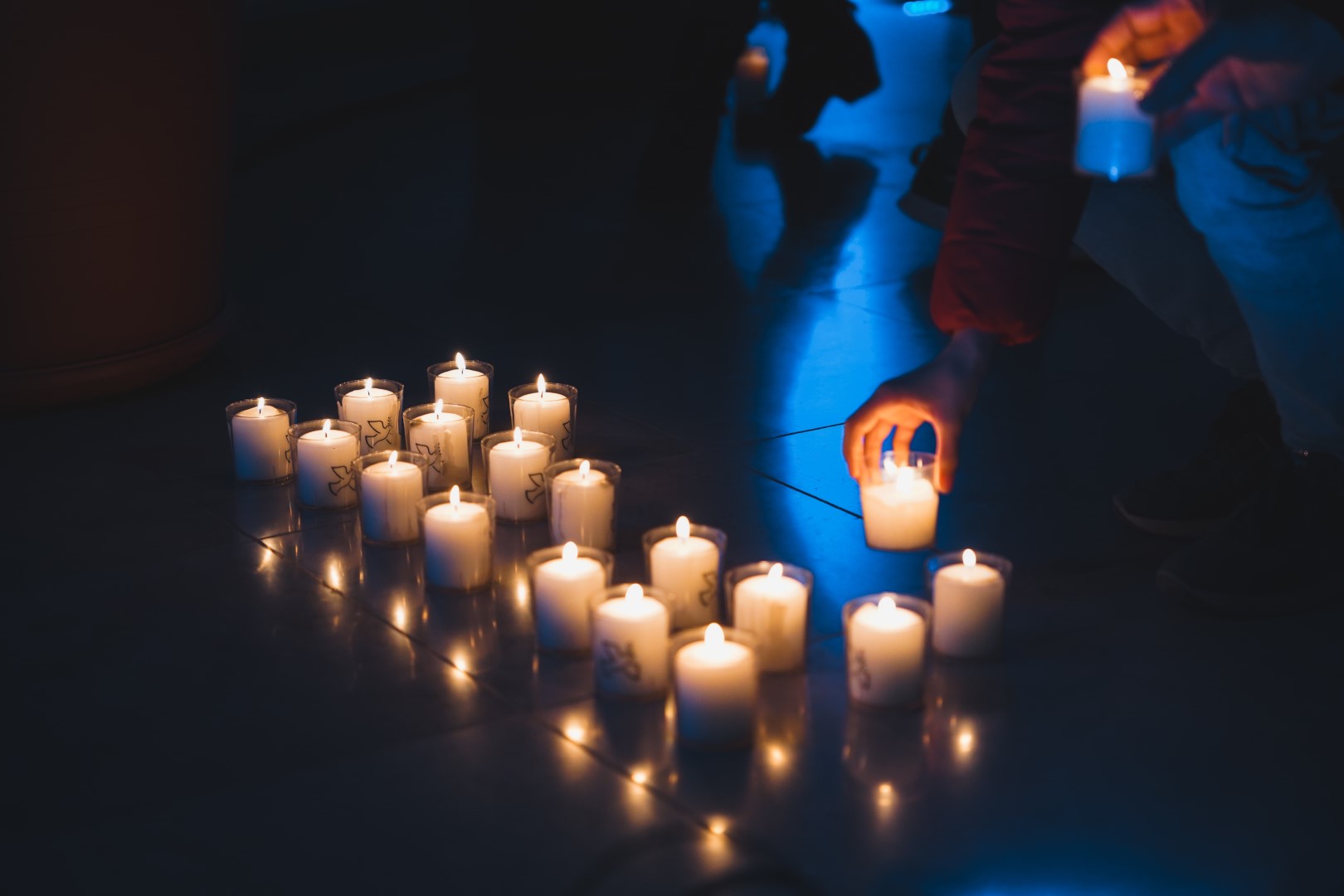 Lighting candles for vigil